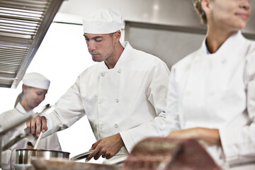 Chefs cooking in restaurant kitchen