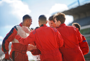 Racer and team talking on track