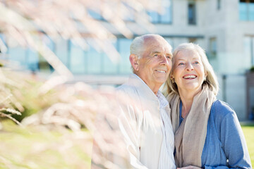 Older couple smiling outdoors