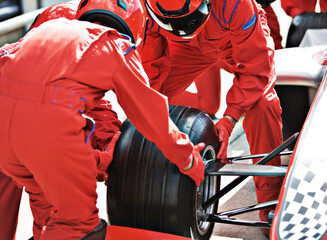 Racing team working at pit stop - obrazy, fototapety, plakaty