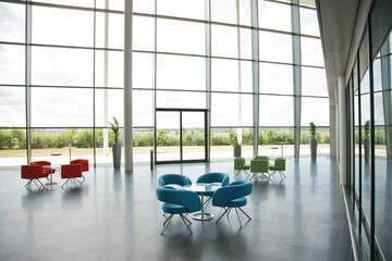 Chairs and tables in office lobby area