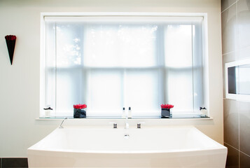 Sink and window in modern bathroom