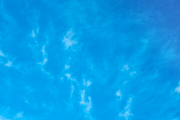 Fototapeta na wymiar Texture of white clouds on a blue sky. white haze in the sky as a background