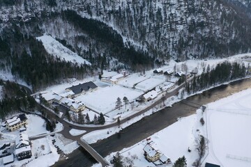 Winter drone shots of the Alps mountains in Austria and Switzerland with lakes 