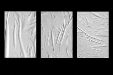 Three white crumpled sheets of paper on a black background.