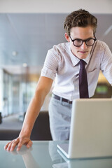 Businessman working on laptop at desk