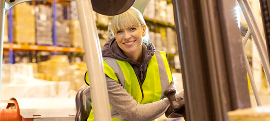 Worker operating forklift in warehouse © Paul Bradbury/KOTO