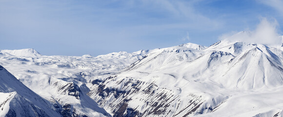 Panorama of winter snowy mountains at nice day