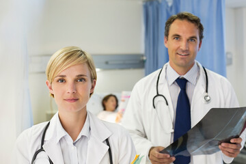 Doctors standing in hospital room