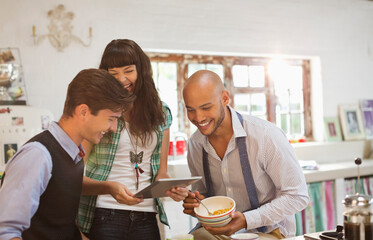 Friends relaxing together in kitchen