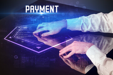 Hand touching digital table with PAYMENT inscription, new age security concept