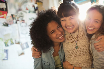 Women smiling together indoors