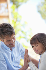 Father and daughter playing outdoors