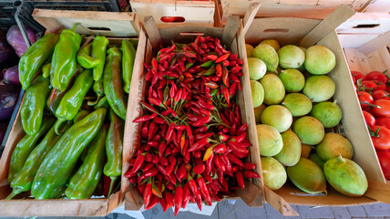 Pepper and other vegetables on the street counter