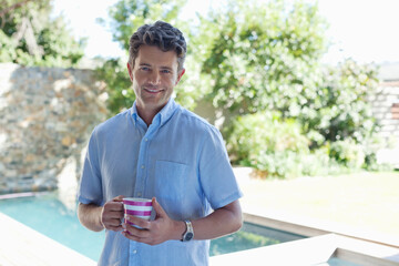 Fototapeta premium Man drinking cup of coffee outdoors