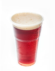 Dark beer in a plastic cup