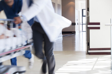 Hospital staff rushing patient to operating room