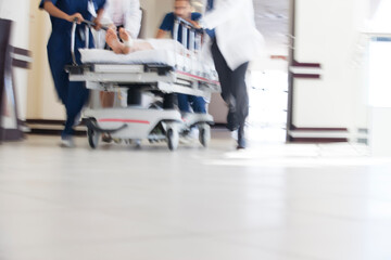 Hospital staff rushing patient to operating room