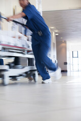 Hospital staff rushing patient to operating room