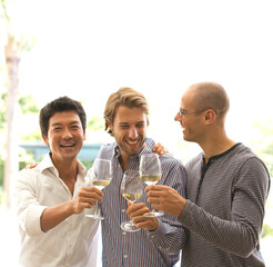 Men toasting each other with wine