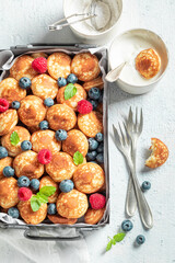 Enjoy your poffertjes as simple and sweet snack