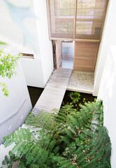 Footbridge in courtyard of modern house