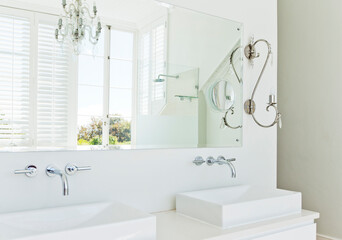 Sinks and mirror in modern bathroom