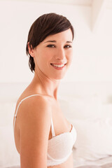 Obraz premium Portrait of smiling woman in bra