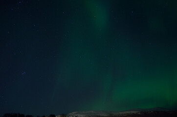 beautiful aurora borealis on autumn night sky