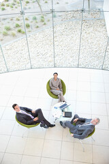 High angle portrait of business people meeting in lobby