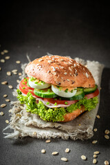 Homemade sandwich with fresh lettuce, egg and tomato
