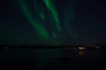 Naklejka na ściany i meble aurora borealis over cold arctic sea