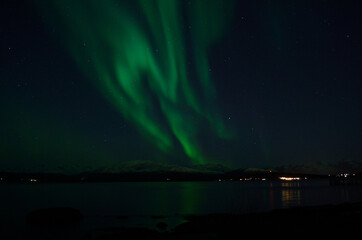 Naklejka na ściany i meble aurora borealis over cold arctic sea