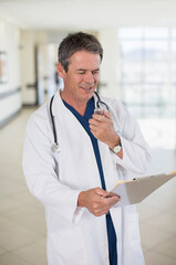 Doctor talking into dictaphone