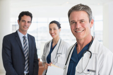 Obraz premium Portrait of smiling doctors and businessman