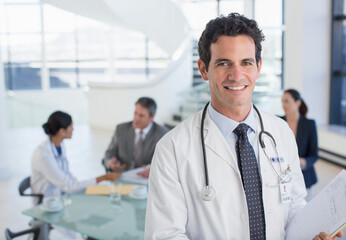 Portrait of smiling doctor in meeting