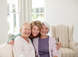 Portrait of smiling senior women in living room