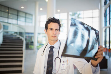 Doctor viewing chest x-rays in hospital