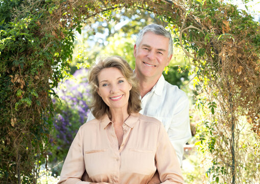 Portrait of smiling senior couple in garden - Powered by Adobe
