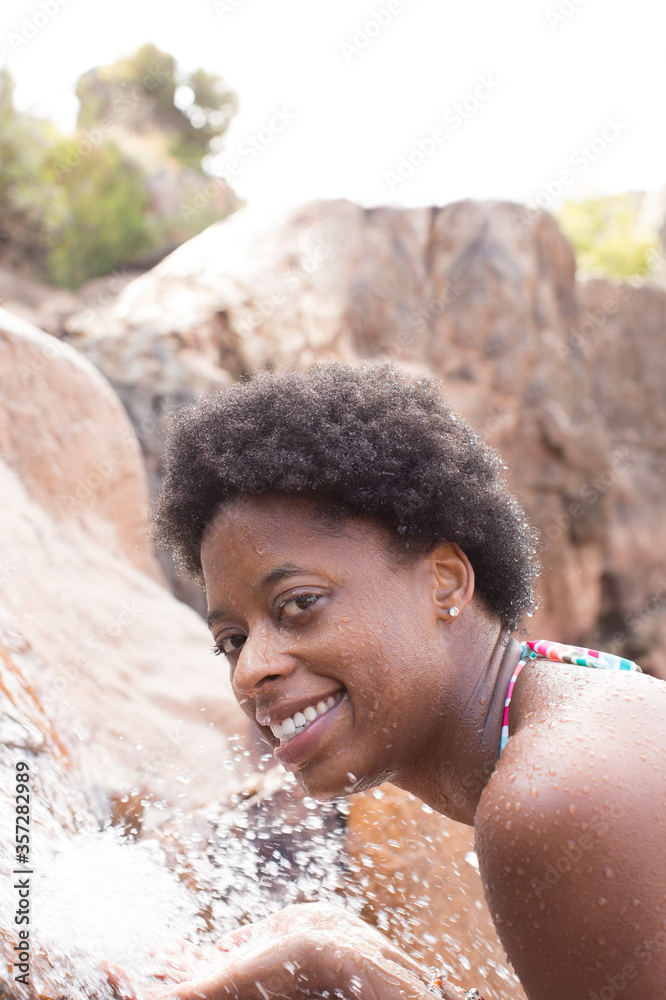 Sticker Portrait of smiling woman at waterfall