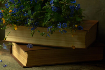 books with flowers close up in vintage style