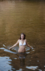 Woman wading in river