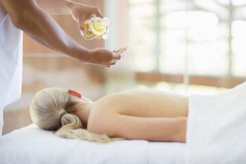 Woman receiving massage at spa