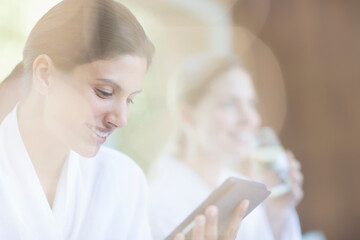 Fototapeta premium Woman using digital tablet at spa