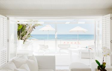 Modern living room overlooking beach and ocean