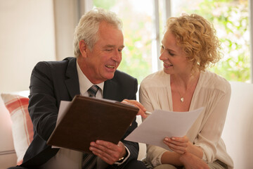 Financial advisor explaining paperwork to woman