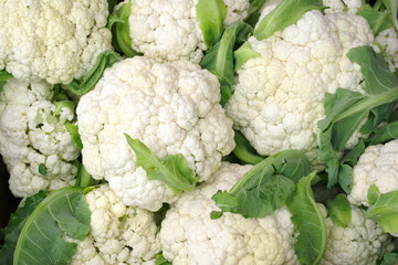 Background with cauliflower. Vegetables in the market