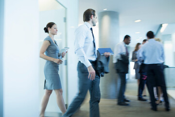 Fototapeta na wymiar Business people walking in office