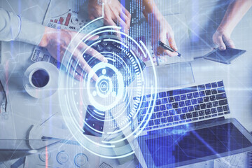 Double exposure of man and woman working together and data theme hologram drawing. Computer background. Top View.
