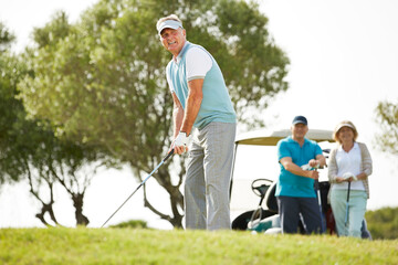 Senior friends playing golf